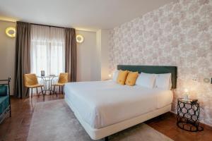 Postel nebo postele na pokoji v ubytování Hotel Cetina Palacio Ayala Berganza