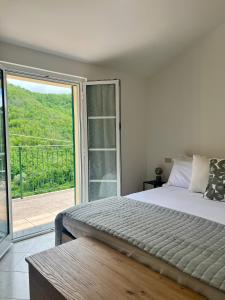 Postel nebo postele na pokoji v ubytování Ardesia apartment