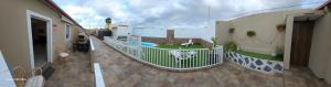 a balcony of a building with a swimming pool at apartamento 1 tenerife sur in Arona