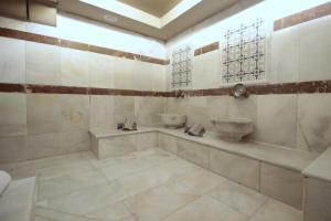 a bathroom with two sinks and a tub at Fuat Bey Palace Hotel & Spa in Istanbul +63 photos