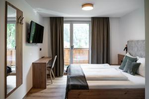 Postel nebo postele na pokoji v ubytování Gasthof Schöntal