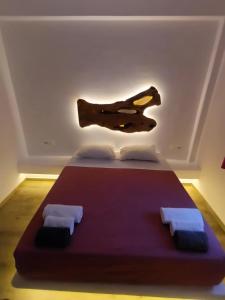 A bed or beds in a room at Alexandra Mykonos Port