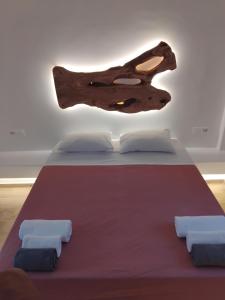 A bed or beds in a room at Alexandra Mykonos Port