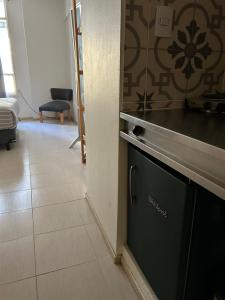 Kuchyň nebo kuchyňský kout v ubytování Maipu Apartment Studio