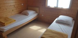 Postel nebo postele na pokoji v ubytování Onlycamp L'Orée des Vosges