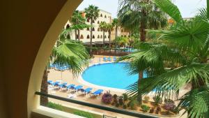The swimming pool at or close to Playa Marina by Ĥ