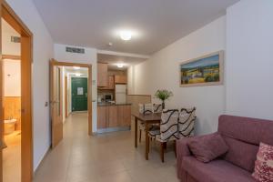 A kitchen or kitchenette at Playa Marina by Ĥ