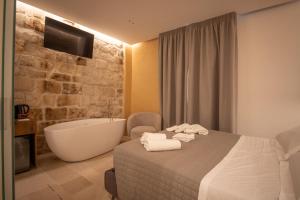 Ένα ή περισσότερα κρεβάτια σε δωμάτιο στο Le Quattro Perle +48 φωτογραφίες