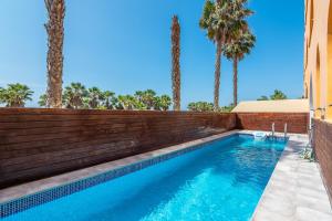The swimming pool at or close to Playa Marina by Ĥ