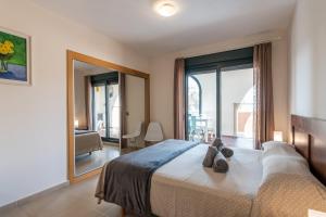 A bed or beds in a room at Playa Marina by Ĥ