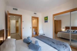 A bed or beds in a room at Playa Marina by Ĥ