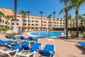 The swimming pool at or close to Playa Marina by Ĥ