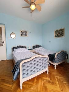 Postel nebo postele na pokoji v ubytování Apartment Magnolia