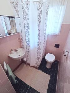 Koupelna v ubytování Apartment Magnolia + 20 fotografií