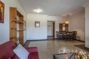 a living room with a couch and a table at El Rincón del Golf III by Ĥ - Isla Canela Golf GRHIII88P88 in Isla Canela