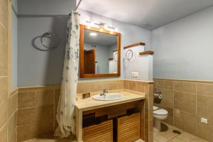 a bathroom with a sink and a mirror at El Rincon del Golf II PLUS by Ĥ - Isla Canela Golf GRHII27P30 in Isla Canela +16 photos