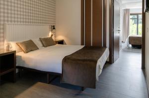 Łóżko lub łóżka w pokoju w obiekcie Alvear Suites