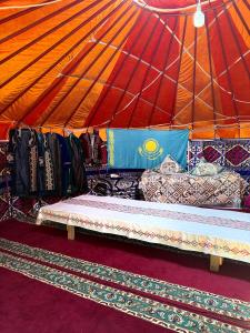 a room with a tent with a bench in it at Юрты РАЯНА in Kurmenty