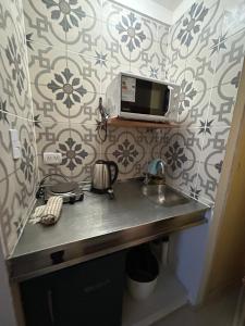 Kuchyň nebo kuchyňský kout v ubytování Maipu Apartment Studio