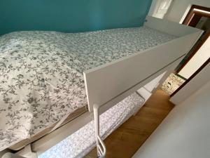 a bedroom with a bed with a bed frame at Casa MammaMarisa in Murano