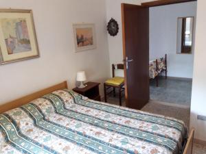 Ένα ή περισσότερα κρεβάτια σε δωμάτιο στο Villa Matassa 4 appartamenti vista mare in San Menaio