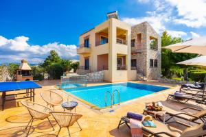 an image of a villa with a swimming pool at Villa Pasiphae 1 in Stalos