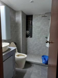 a bathroom with a toilet and a sink at Dar Al Habib in Dhaka