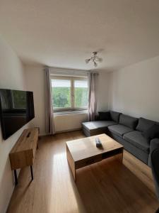 a living room with a couch and a coffee table at Forvere in Hof