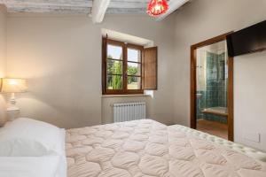 A bed or beds in a room at Villa San Michele by PosarelliVillas