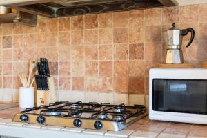 A kitchen or kitchenette at Villa San Michele by PosarelliVillas
