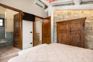 A bed or beds in a room at Villa San Michele by PosarelliVillas