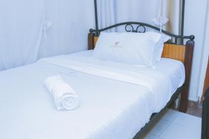 Postel nebo postele na pokoji v ubytování LAZARUS KAKA CBD Accomodations