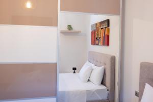 a room with a bed and a mirror at Balance Suite in Kourouta +65 photos