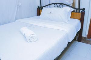 Postel nebo postele na pokoji v ubytování LAZARUS KAKA CBD Accomodations