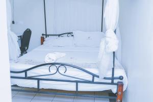 Postel nebo postele na pokoji v ubytování LAZARUS KAKA CBD Accomodations