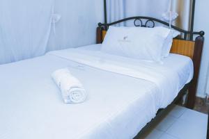 Postel nebo postele na pokoji v ubytování Lazarus Kaka Hotel Urbane