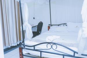 Postel nebo postele na pokoji v ubytování LAZARUS KAKA CBD Accomodations