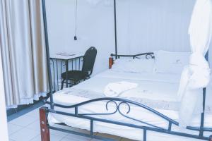 Postel nebo postele na pokoji v ubytování LAZARUS KAKA CBD Accomodations