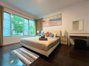 a bedroom with a large bed and a fireplace at Relaxing Link to beach with pool in Hua Hin +25 photos