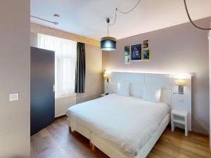 Postel nebo postele na pokoji v ubytování greet hotel Lille Gare Flandres - Groupe Accor