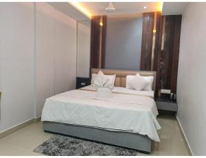 Postel nebo postele na pokoji v ubytování Hotel sai deogar
