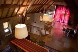 an overhead view of a living room with two large lamps at La Source de Manon in Camboulit