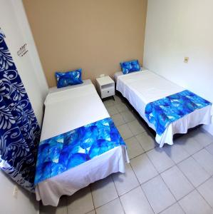 Rúm í herbergi á HOTEL TRAVEL Encarnación