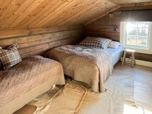 Ένα ή περισσότερα κρεβάτια σε δωμάτιο στο Ørnenipa Lodge By Gaustatoppen With Panoramic View