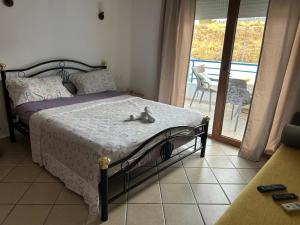 a bedroom with a bed with a cat laying on it at Cabo Dream a Cabo Negro in Cabo Negro +9 photos