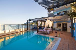 a swimming pool on the roof of a building at SALTY BREEZE Beachfront Villa in Lygia