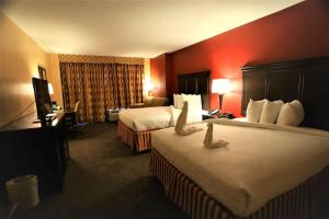 Postel nebo postele na pokoji v ubytování Hotel DSR Tark Plaza Near IGI Airport Delhi