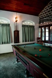 a billiard room with a pool table in it at Southwinds, Pilagoda Estate Bungalow in Pillagoda