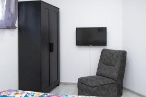 TV a/nebo společenská místnost v ubytování Sweet Dreams Apartment