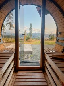 a view from the inside of a cabin with a large window at Log Cabin With Views Over Turufjell in Flå